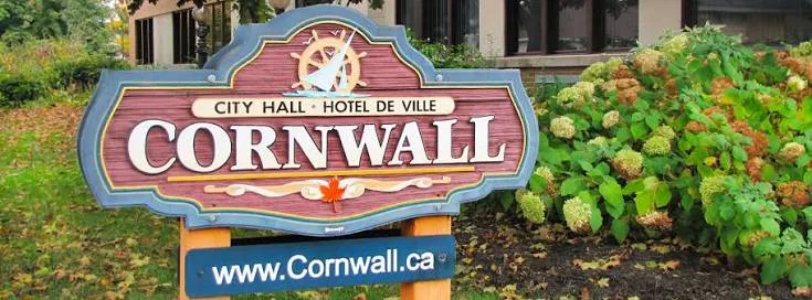 The wooden Cornwall City Hall sign, representing local debt consolidation and financial consulting services for residents in Cornwall, Ontario.