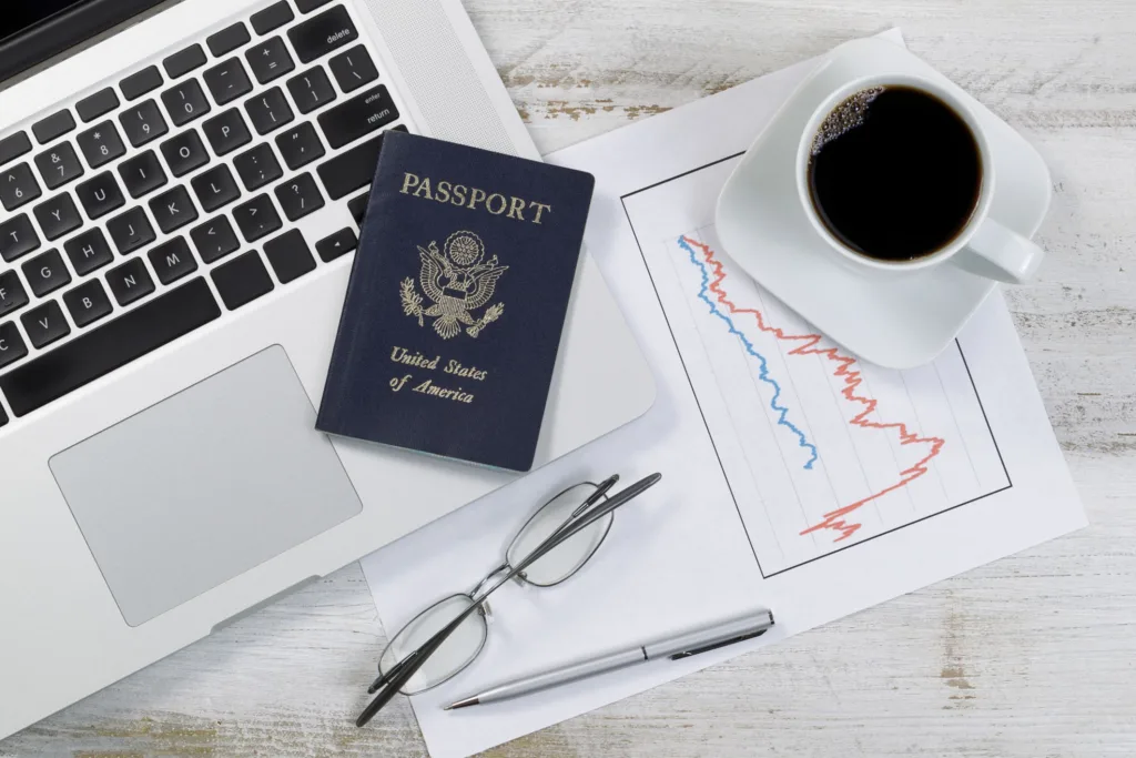 Canadian passport and financial charts representing Super Visa insurance planning in 2026.